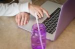 Woman Sitting On The Floor Using Laptop Stock Photo