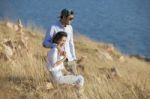 Portrait Of Asian Younger Man And Woman Relaxing Vacation At Sea Side Happiness Emotion Stock Photo