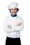 Confident Young Chef Posing In Uniform Stock Photo