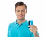 Smiling Man Holding Credit Card Stock Photo