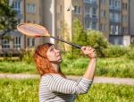 Young Beautiful Woman Playing Badminton Stock Photo