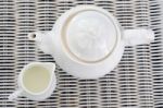 Top View Of Teapot With Little Milk Jar Stock Photo