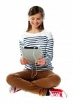 Girl Watching Video On Her Tablet Stock Photo