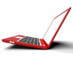 Red Sideways Computer On Desk With White Copyspace Stock Photo