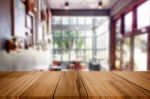 Selected Focus Empty Brown Wooden Table And Coffee Shop Or Resta Stock Photo