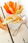 Fresh Hummus Dip With Raw Carrot And Celery Stock Photo