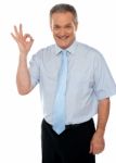 Male Executive Showing Okay Sign Stock Photo