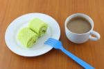 Green Sweet Roll Cake And Sweet Beverage On Breaking Time Stock Photo