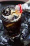 Pouring Cola Into Glass Stock Photo