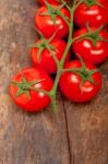 Fresh Cherry Tomatoes On A Cluster Stock Photo