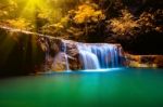 Erawan Waterfall In Thailand In Deep Forest With Sunbeam Stock Photo