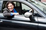 Young Businessman Parking His Car Stock Photo