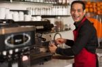 Happy Barista Staff Preparing The Order Stock Photo