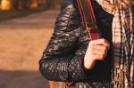 Young Woman Hand On Her Backpack, Warm Toning Stock Photo