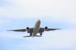 Passenger Jet Plane Flying Against Beautiful Blue Sky With Copy Stock Photo