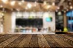 Selected Focus Empty Brown Wooden Table And Coffee Shop Or Resta Stock Photo