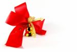 Golden Bell With Red Satin Bow Stock Photo