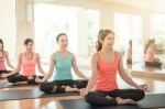 Asian Woman Doing Yoga Indoors Stock Photo