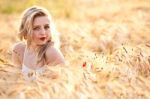 Portrait Of Beautiful Girl In Field Stock Photo