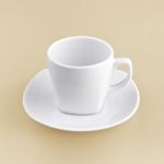 White Cup On Orange Background Solid Stock Photo