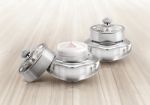 Silver Deluxe Cosmetic Jar On Wood Background Stock Photo