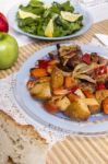 Oven Baked Meat With Potatoes, And Watercress Salad Stock Photo