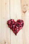 Heart Formed By Red Rose Petals On Wooden Background Stock Photo