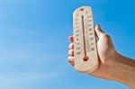 Wooden Thermometer Stock Photo