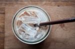 Top View Of Iced Coffee On Wooden Table Stock Photo