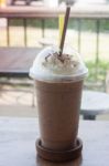 Iced Coffee On Wooden Table Stock Photo