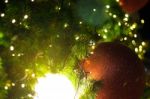 Close Up Big Red Glitter Ball Christmas On Tree With Wire White Light Background Stock Photo