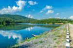 Landscape Of The Dam And Lake On The Mountain With Tree And Forest And The Boat Stock Photo