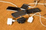 Phone Chargers On The Floor Stock Photo