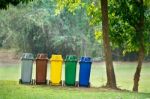 Recycle Bins In Garden Stock Photo