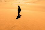 Early Morning Climbers On Sand Dune Near Sossusvlei, Namibia Stock Photo