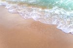 Bubble Of Sea Wave On Sand Stock Photo