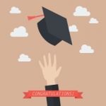 Hand Of Graduate Throwing Graduation Hats In The Air Stock Photo