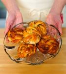 Female Hands Showing Pastries Stock Photo