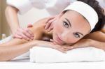 Woman Enjoying Shoulder Massage At Beauty Spa Stock Photo