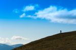 Traveller Descending To Ocean Landscape Backdrop Stock Photo