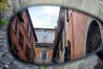 Old Italian Architecture Reflected In A Motorcycle Mirror Stock Photo