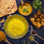 Indian Pilau Rice In Balti Dish Served With Chicken Tikka Masala Stock Photo