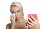 Young Woman Clean Face With Wet Wipes And Holding Mirror Stock Photo