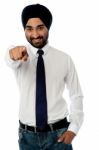 Smiling Businessman Pointing Towards You Stock Photo