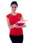 Smiling Girl Holding Clipboard Stock Photo