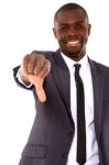 Businessman With Thumb Down Stock Photo