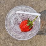 White Drinking Straw And Strawberry Stock Photo