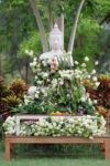 Buddhism Worship With Offering Flowers And Garland To Buddha Statue On Magha Puja, Asalha Puja And Visakha Puja Day In Thailand Stock Photo