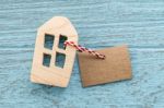 Wood House With Blank Paper Tag Stock Photo