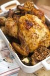 Roasted Chicken With Garlic And Potatoes Stock Photo